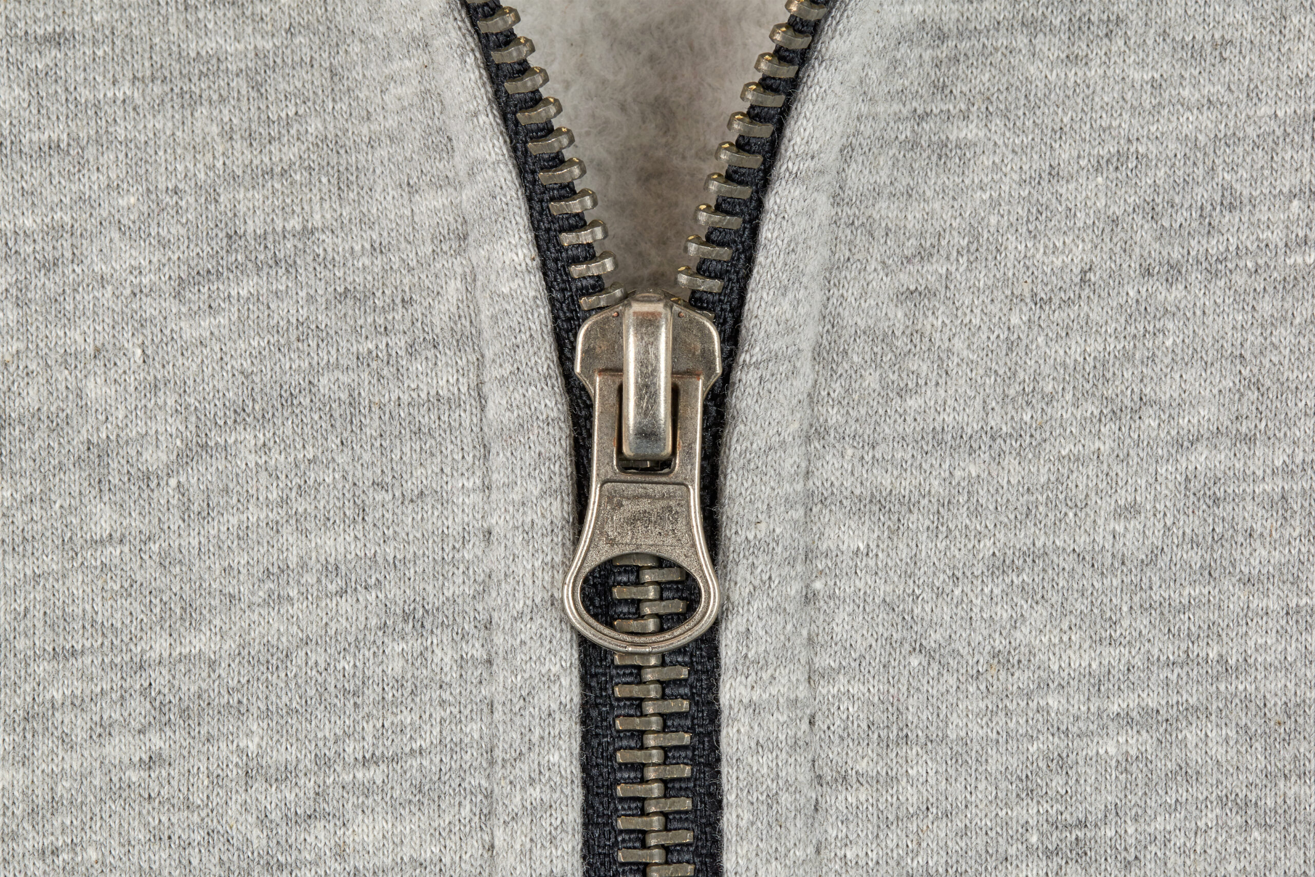 Zipper on the knitted jacket close up